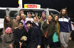 Party van-goers en route to the Stone Church, complete with magician! Photo by Kara Kharmah